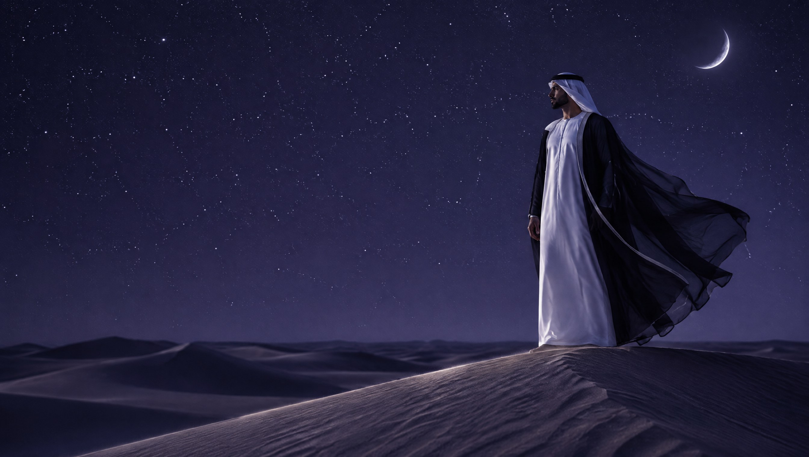 A man in a white kandura and a sheer black bisht lifted by the wind, standing on a dune crest under a violet night sky with a crescent moon